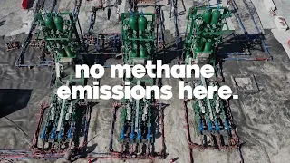 No methane emissions here in blocky white text is overlaid on an aerial image of three AutoSep Control Units aligned on an oil rig pad.